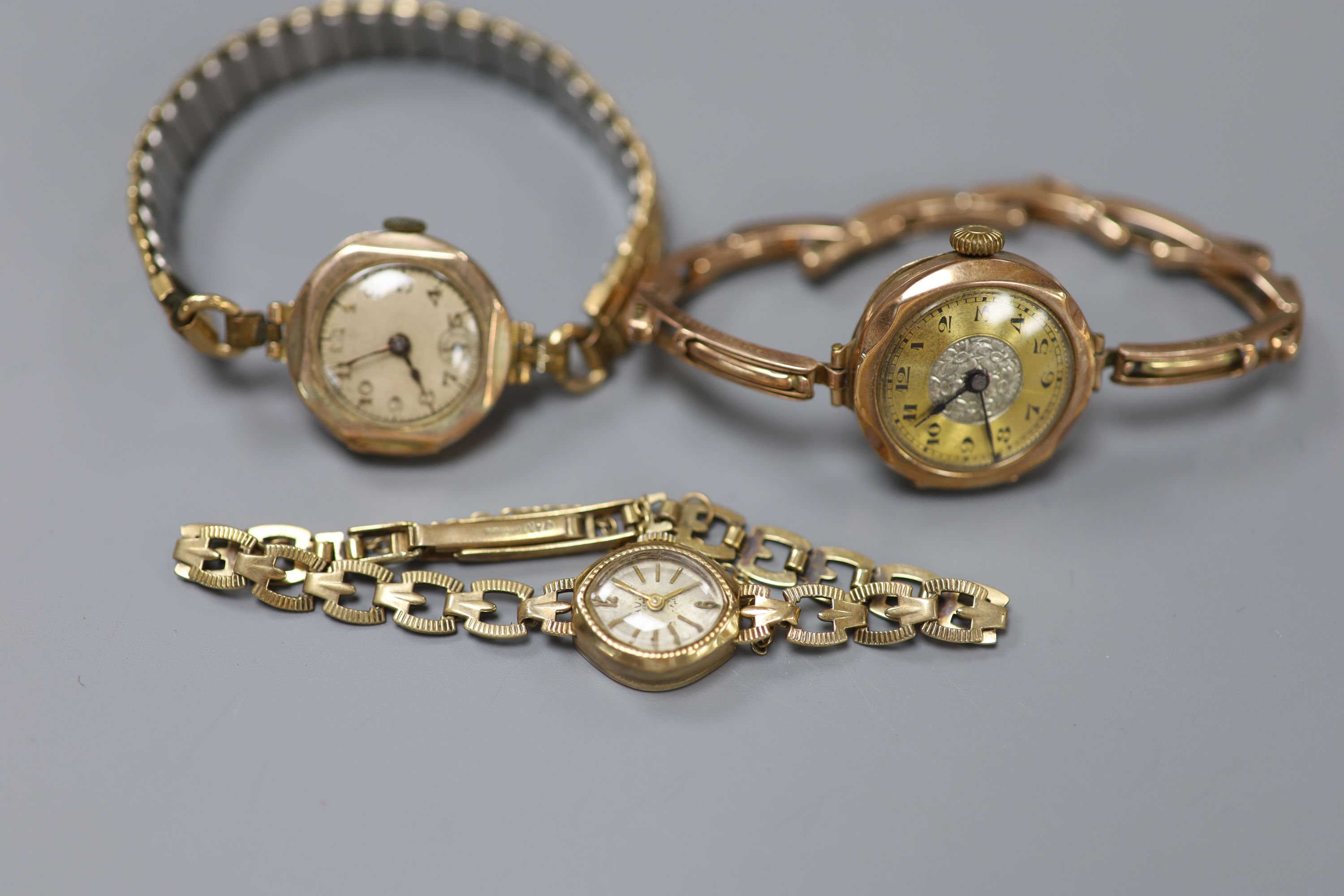 Three 9ct gold-cased ladys wristwatches, one with 9ct gold marked bracelet (latter gross 11.5 grams).